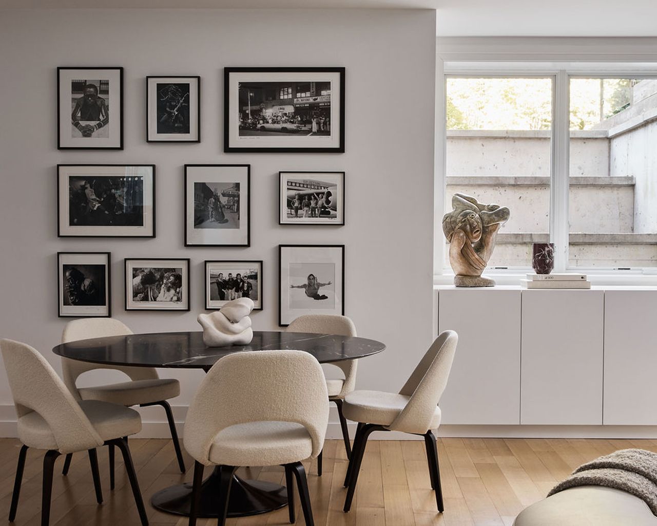 a photo wall in a modern neutral room scheme