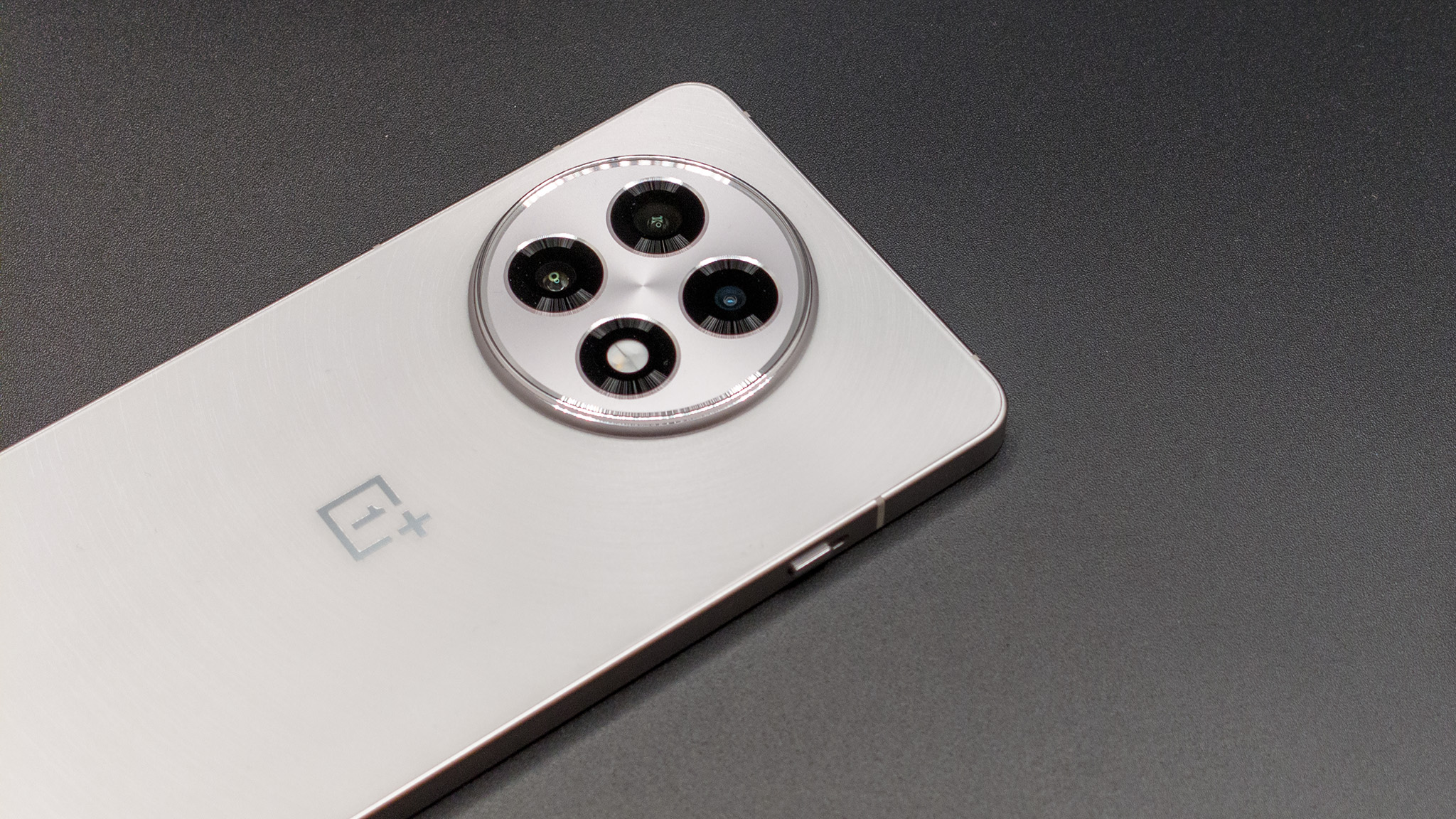 The raised camera island on the back of the white OnePlus 13R