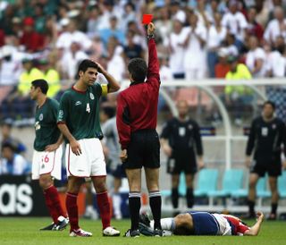 Mexico's Rafa Marquez is shown the red card after a foul on United States' Cobi Jones at the 2002 World Cup.