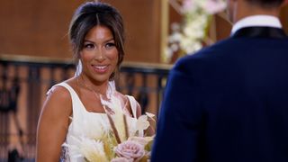 Karla is only one of ten singles hoping for wedded bliss but is he the Juan for her? Both are pictured at the altar. Watch Married at First Sight USA 2024 (season 18) to find out.