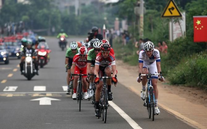 Riders grimace in the break.