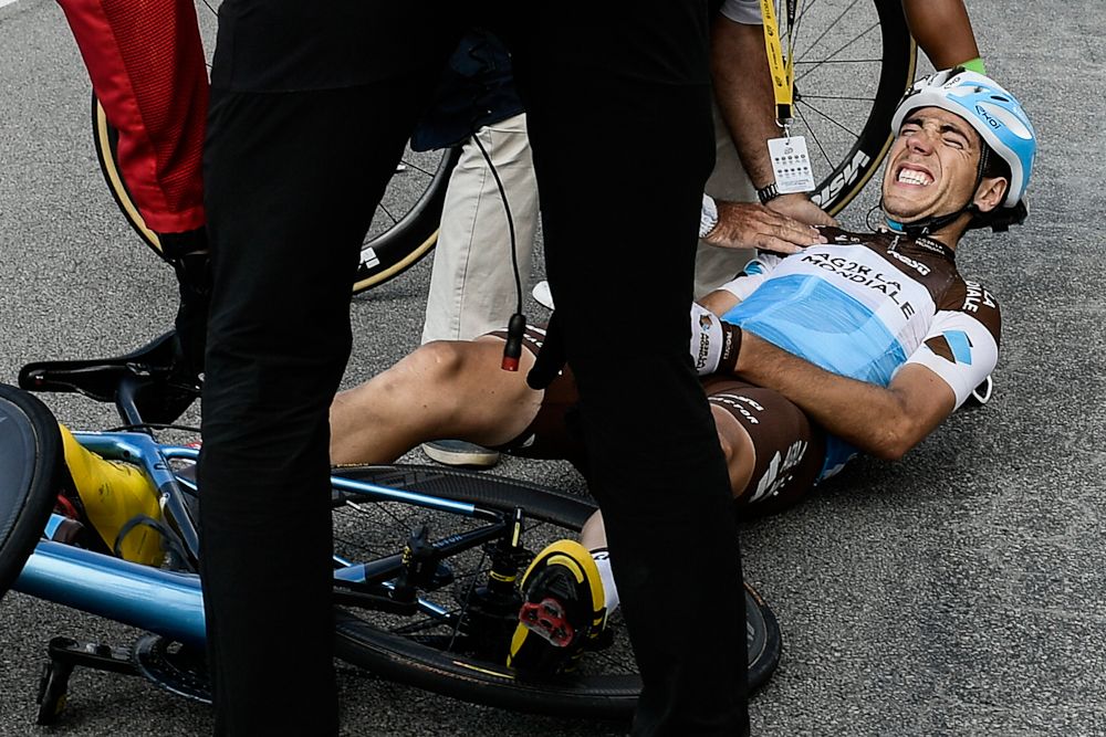 Axel Domont grimaces after being caught in a massive pack fall in the last kilometers of the fourth stage of the 105th edition of the Tour de France