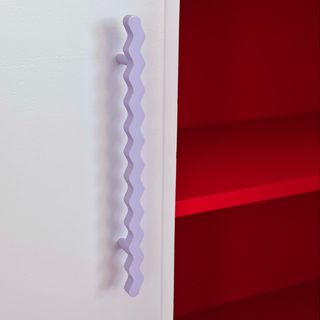 Lilac squiggle kitchen cabinet handles.