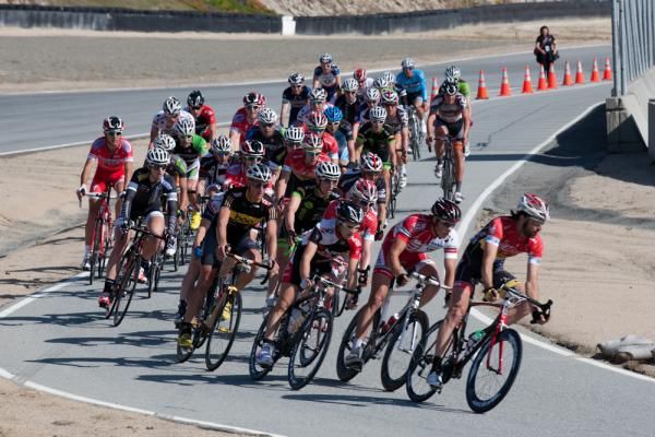 The men's field makes its way through the narrow passage on the Sea Otter criterium course.