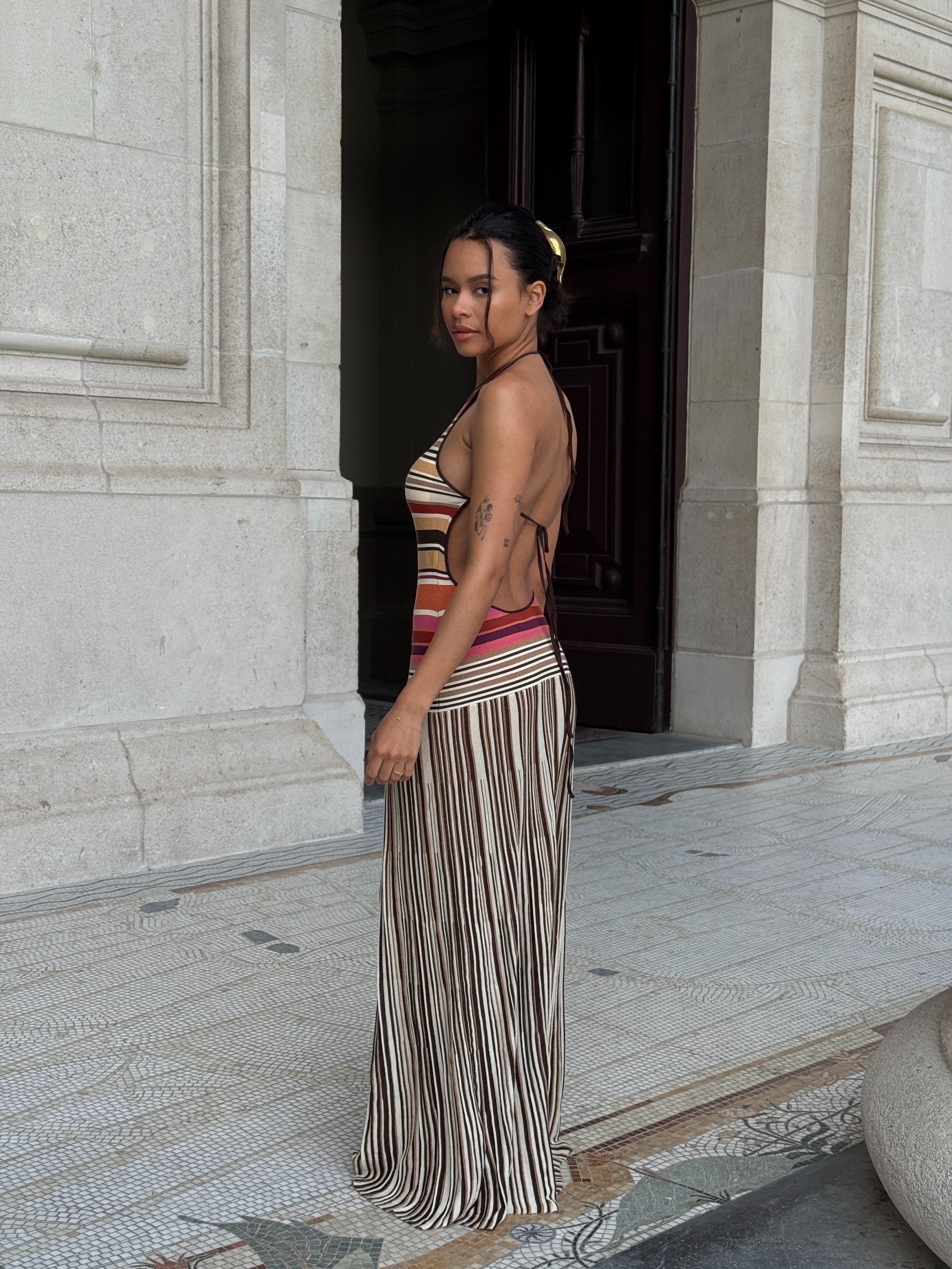 An image of a woman wearing best backless dress summer 2026