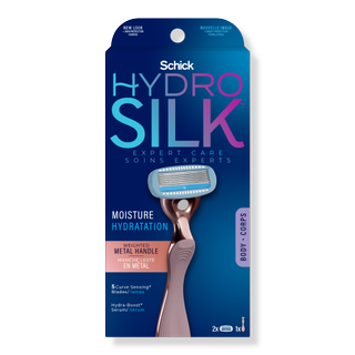 pack of Schick Hydro Silk Rose Gold Metal Handle Razor on a gray background