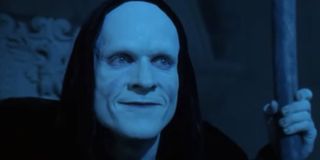 Bill & Ted's Bogus Journey Death holds his scythe with a smile