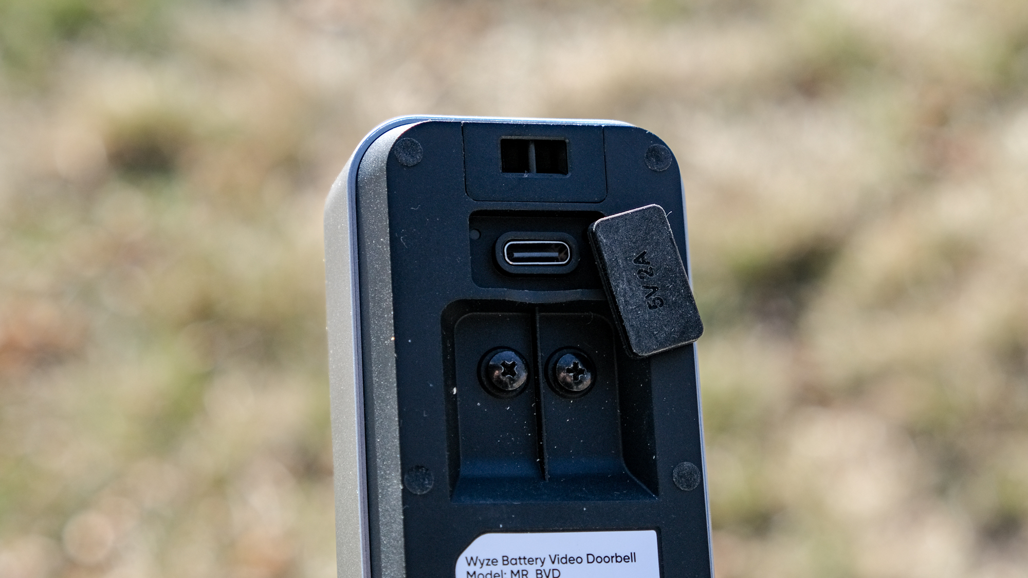 A Wyze Battery Video Doorbell mounted on a door frame