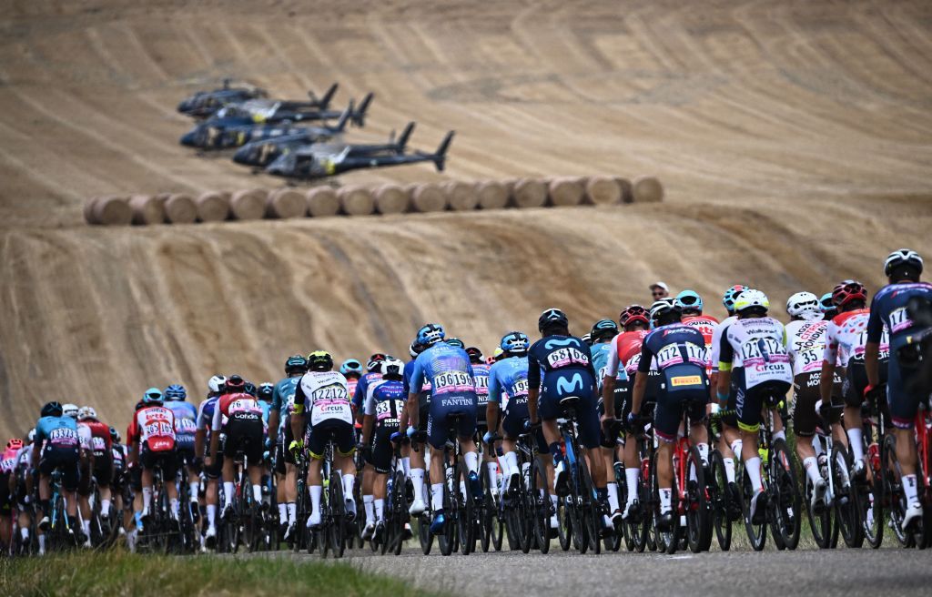 TOPSHOT The pack of riders cycles during the 19th stage of the 109th edition of the Tour de France cycling race 1883 km between CastelnauMagnoac and Cahors in southwestern France on July 22 2022 Photo by AnneChristine POUJOULAT AFP Photo by ANNECHRISTINE POUJOULATAFP via Getty Images