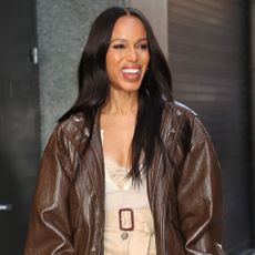 Kerry Washington wears a brown jacket