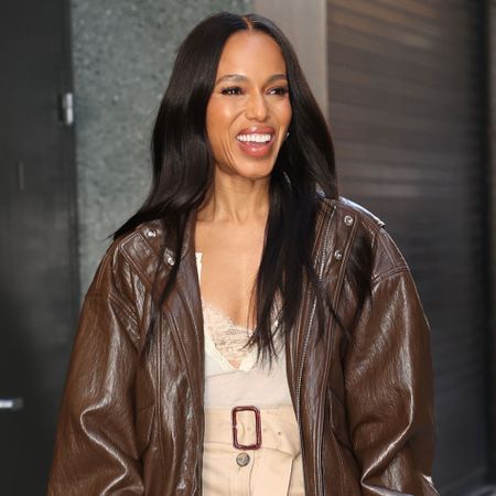 Kerry Washington wears a brown jacket