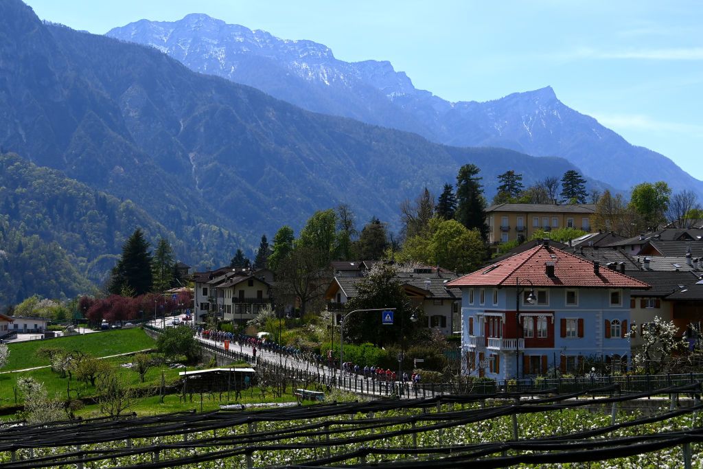 SAN MARTINO DI CASTROZZA ITALY APRIL 18 A general view of the peloton passing through mountain landscape during the 45th Tour of the Alps 2022 Stage 1 a 1609km stage from Cles to PrimieroS Martino di Castrozza 708m TouroftheAlps on April 18 2022 in San Martino di Castrozza Italy Photo by Tim de WaeleGetty Images