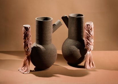 Two pots with crafted covers over spouts, by Studiopepe, part of Irthi project