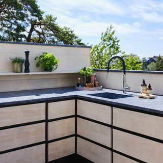 Outdoor L shaped kitchen with sink