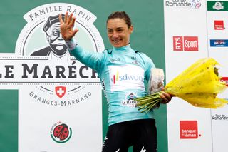 Ashleigh Moolman-Pasio on stage after winning the overall classification at the Tour de Romandie Feminin