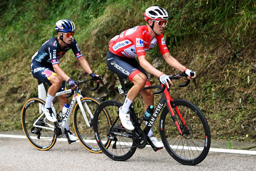 PAJARES SPAIN SEPTEMBER 01 LR Primoz Roglic of Slovenia and Team Red Bull Bora hansgrohe and Ben OConnor of Australia and Team Decathlon AG2R La Mondiale Red Leader Jersey compete during the La Vuelta 79th Tour of Spain 2024 Day 15 a 143km stage from Infiesto to ValgrandePajares Cuitu Negru 1835m UCIWT on September 01 2024 in Pajares Spain Photo by Dario BelingheriGetty Images