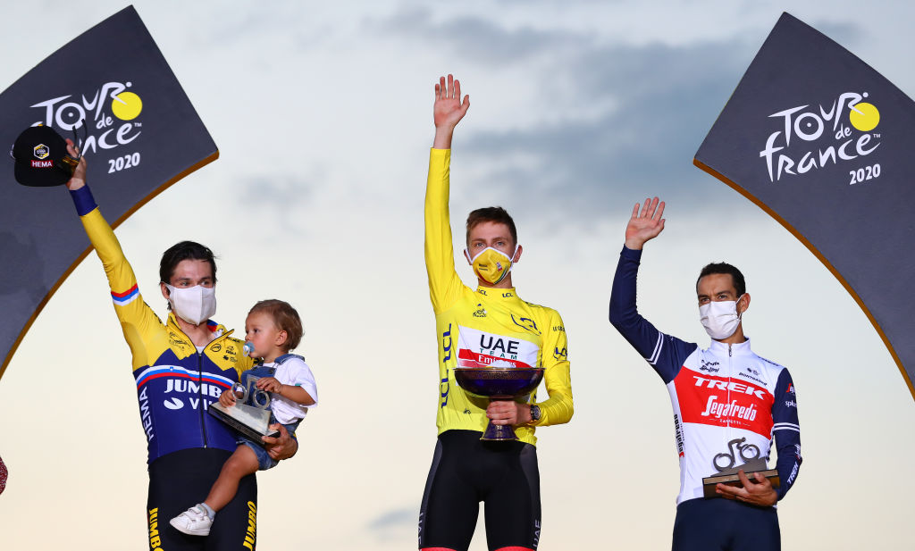 PARIS FRANCE SEPTEMBER 20 Podium Primoz Roglic of Slovenia and Team Jumbo Visma with his son Levom Tadej Pogacar of Slovenia and UAE Team Emirates Yellow Leader Jersey Richie Porte of Australia and Team Trek Segafredo Celebration Trophy Mask Covid safety measures during the 107th Tour de France 2020 Stage 21 a 122km stage from MantesLaJolie to Paris Champslyses TDF2020 LeTour on September 20 2020 in Paris France Photo by Michael SteeleGetty Images