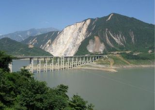 After the earthquake: The Zipingpu Reservoir in China. The dam, located further down the road and out of frame, was cracked during the quake. As a precaution, reservoir water level was lowered.