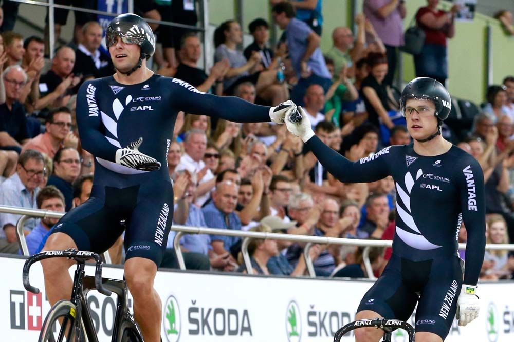 The local crowd cheers Eddie Dawkins (L) and Sam Webster (R) of New Zealand following their Mens' sprint quarter-final
