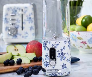 A Laura Ashley & VQ hand blender on a marble surface