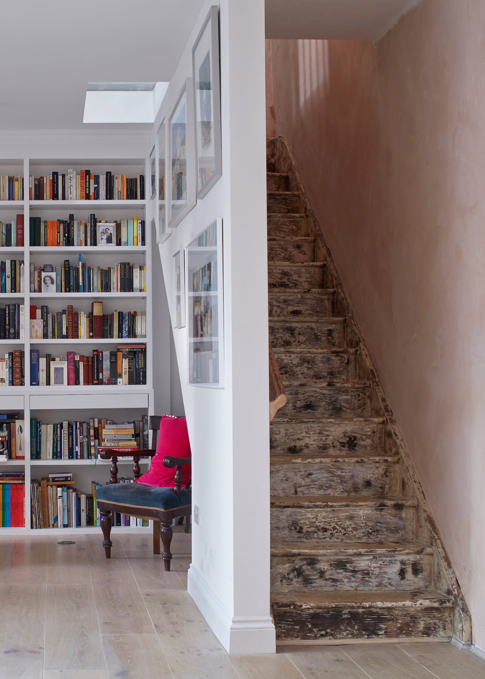 Unfinished steps in enclosed staircase next to library sitting room