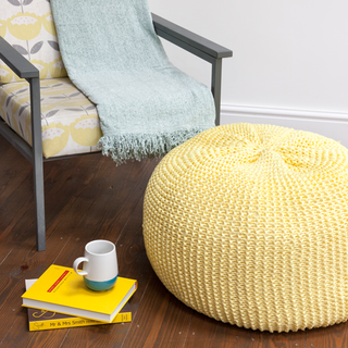 pouffe with wooden flooring and chair
