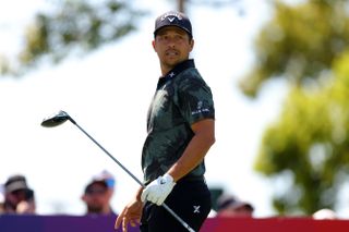 Xander Schauffele watches his tee shot