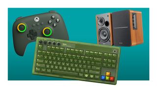 A green 8bitdo mouse and keyboard side by side with Edifier speakers in wood tones.