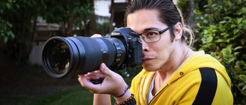 Man taking photo using Nikon D850