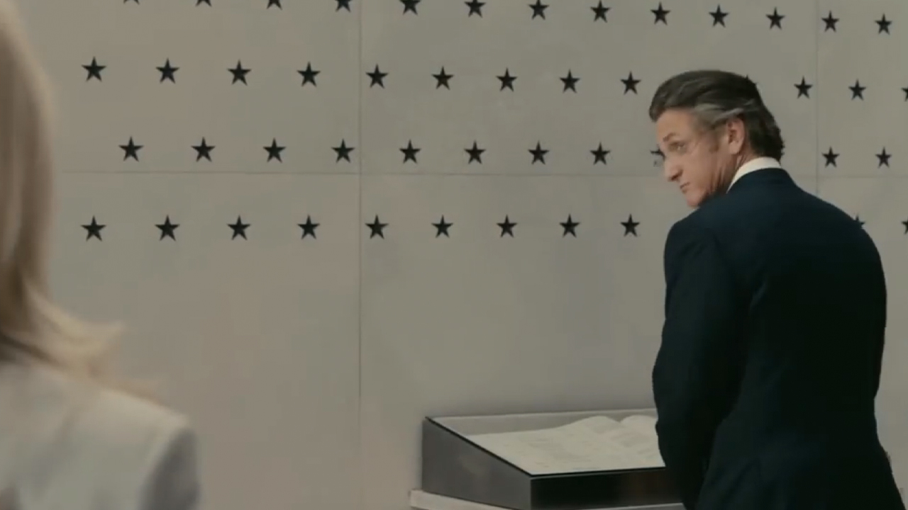 Sean Penn standing in front of the memorial wall at CIA in Fair Game