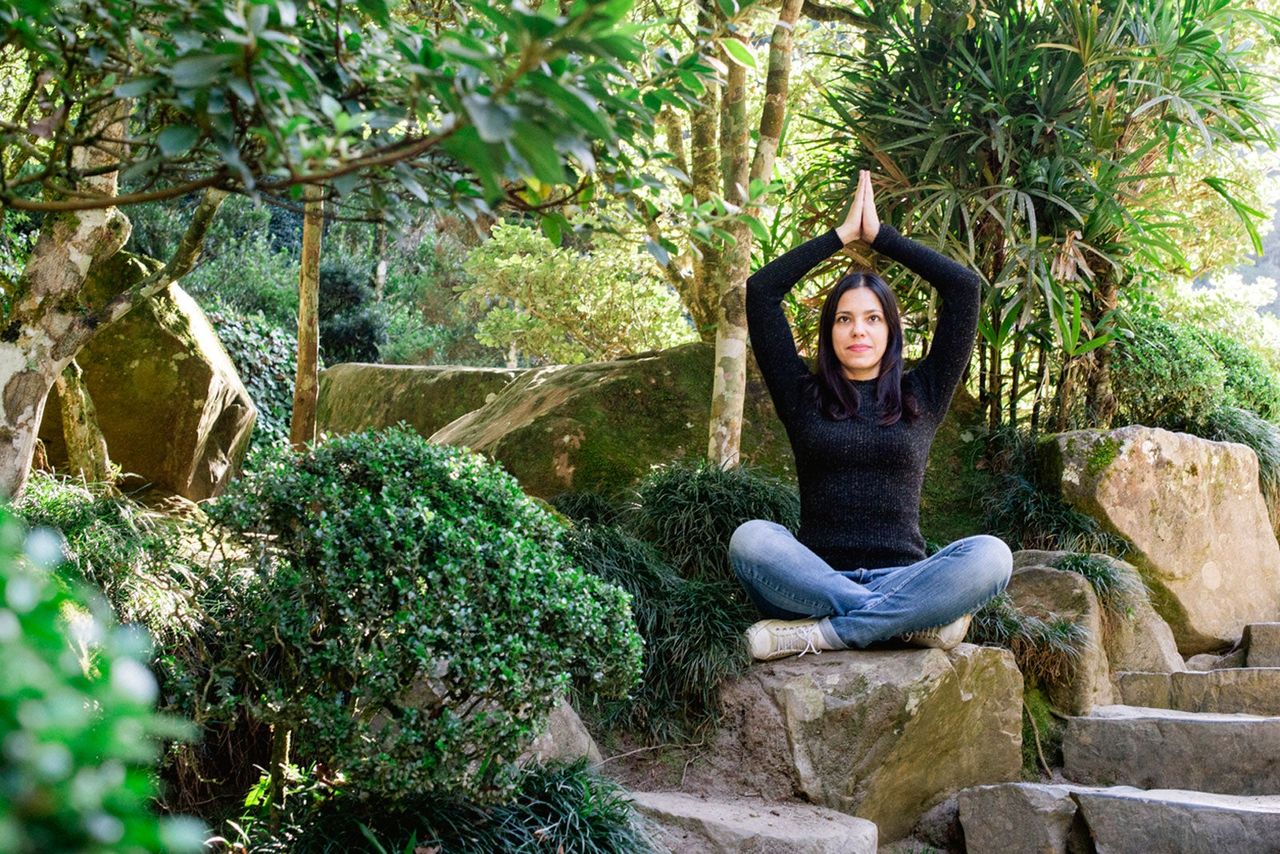 Woman Doing Yoga In The Garden