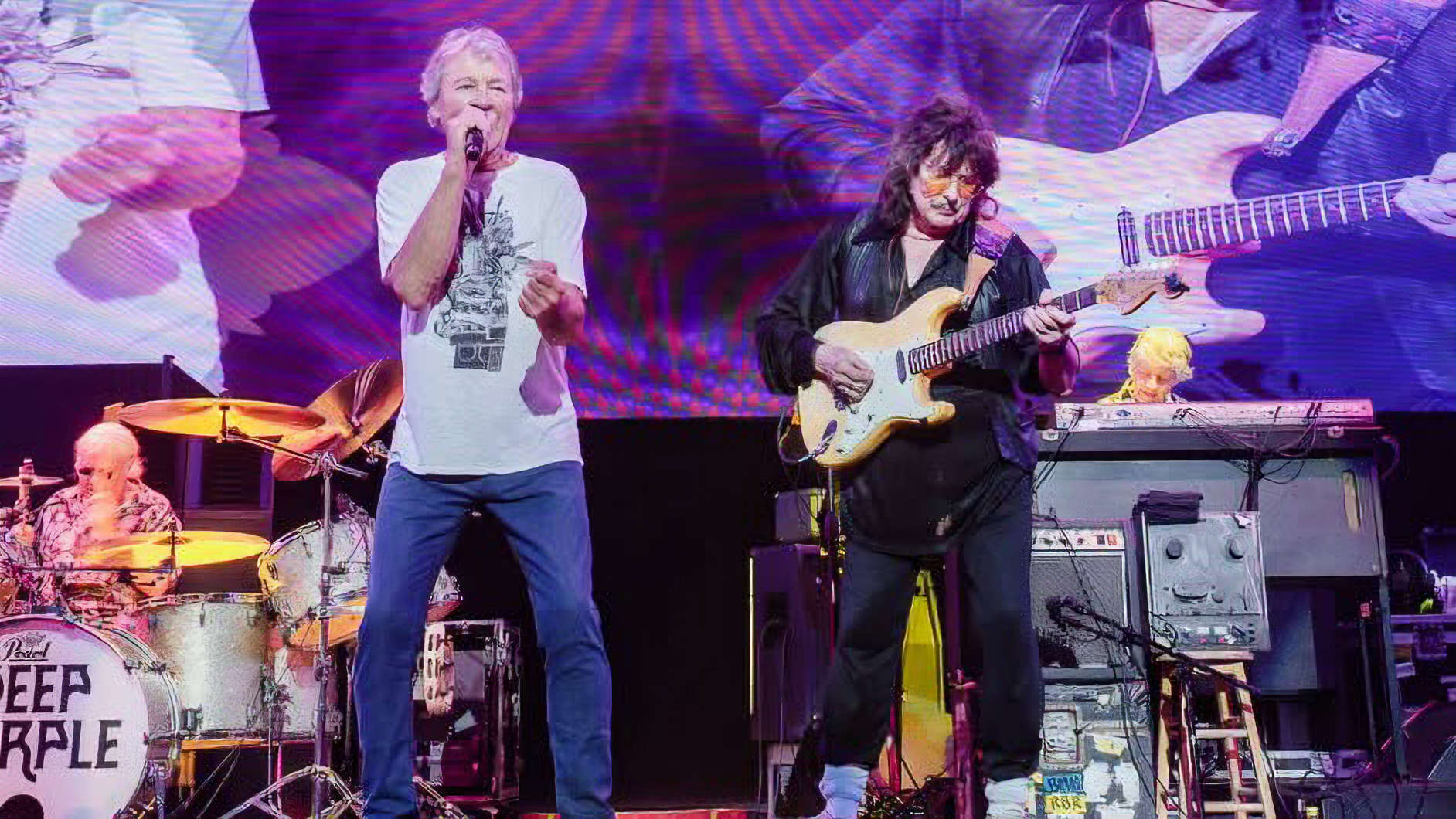 Deep Purple perform with Ritchie Blackmore on August 12, 2026, at their first performance with the guitarist in 33 years. From left: Ian Paice, Ian Gillan and Blackmore