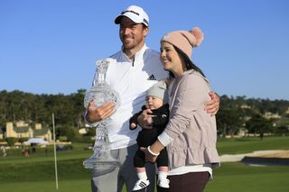 Nick Taylor poses with the 2020 AT&T Pebble Beach Pro-Am trophy alongside wife Andie and his son, Charlie