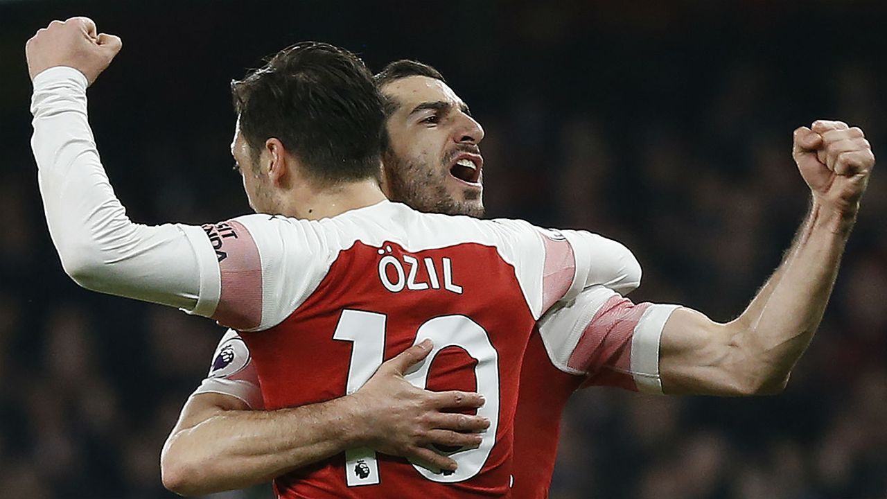 Henrikh Mkhitaryan celebrates a goal with Arsenal team-mate Mesut Ozil 