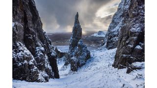 Tall rock formations in snowy conditions