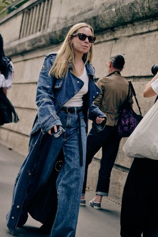 Woman at Fashion Week wearing a denim jean jacket