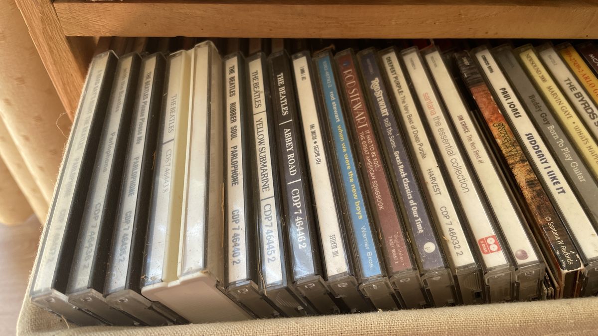 A car's CD player and burned CDs, on a hot day