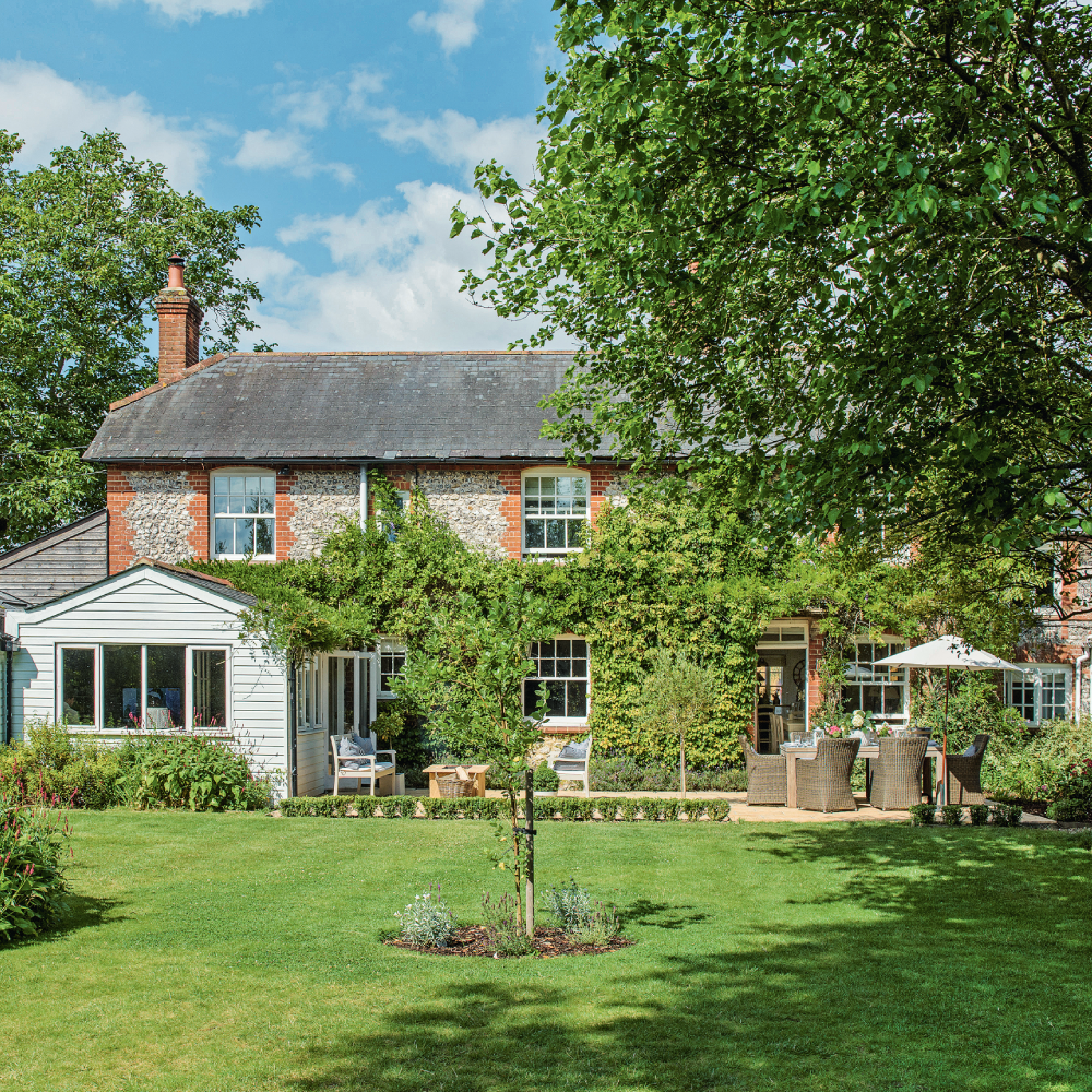 exterior of house with blue sky and green tree