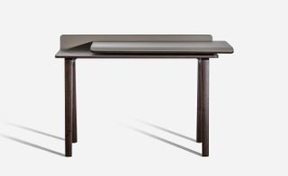 A simple desk design by Kensaku Oshiro for Poltrona Frau, with a solid ash base and grey leather top. The desk also features a double top that can be slid to one side to change the work surface or create storage