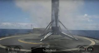 A SpaceX Falcon 9 first stage rests on the drone ship Of Course I Still Love You after launching and landing on May 10, 2023.