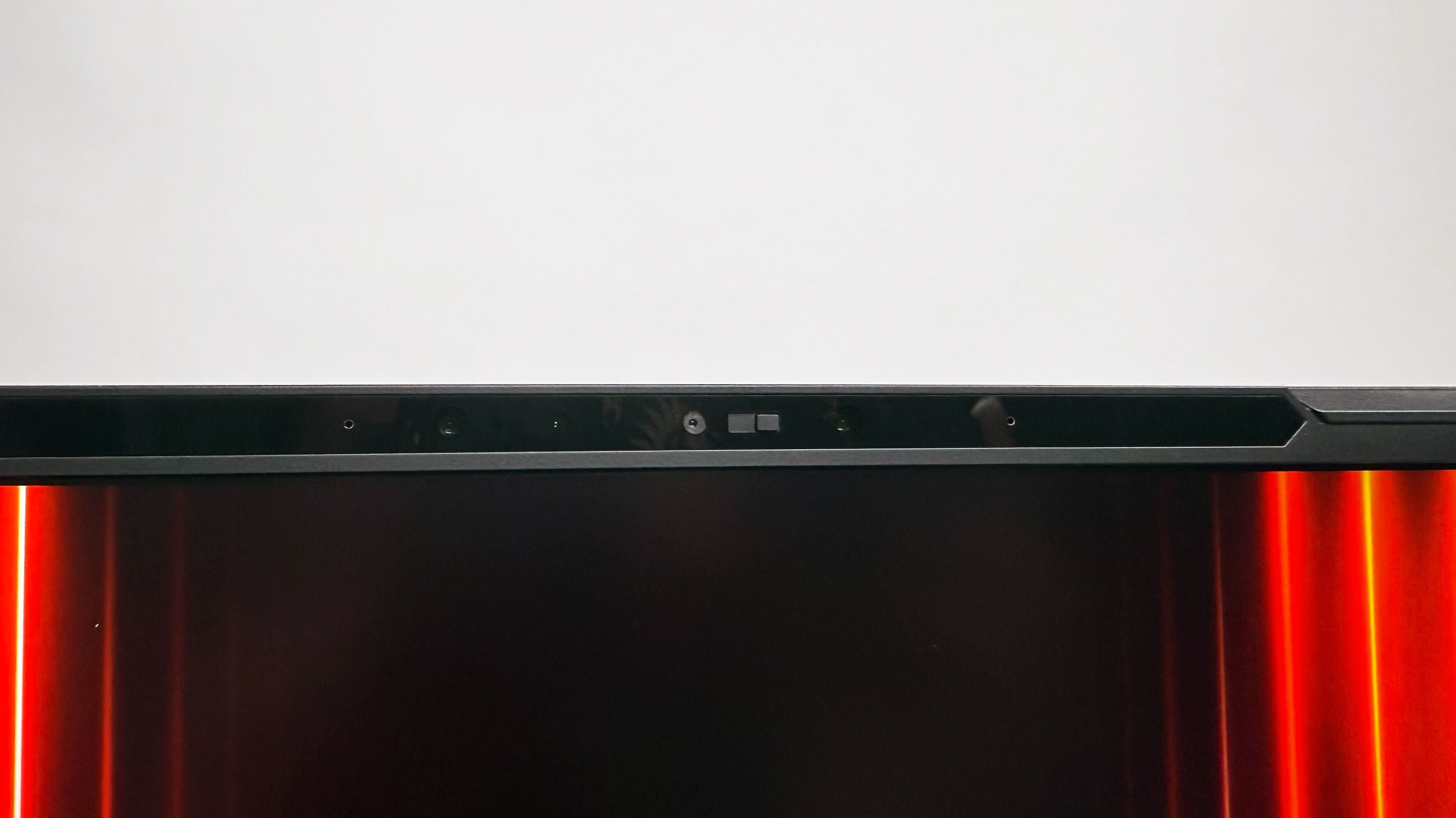 Close up of the webcam on the MSI Raider 18 HX AI gaming laptop against a gray background.