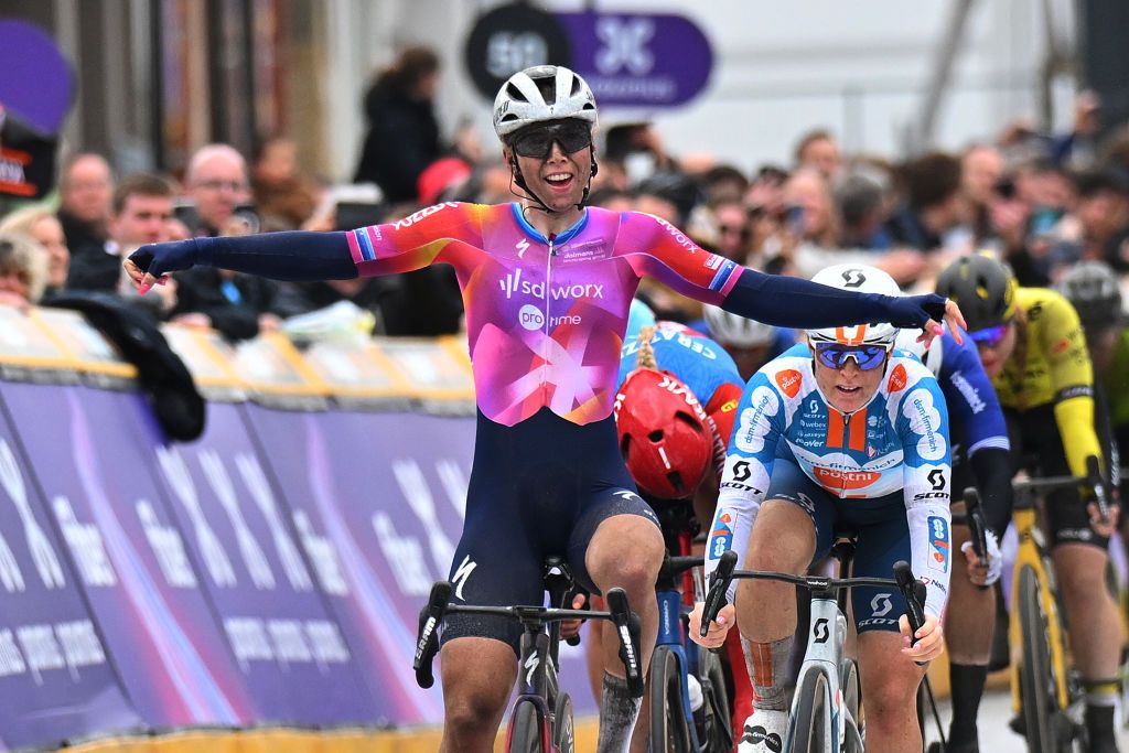 SCHOTEN BELGIUM APRIL 03 Lorena Wiebes of The Netherlands and Team SD WorxProtime celebrates at finish line as race winner ahead of Charlotte Kool of The Netherlands and Team DsmFirmenich PostNl during the 112th Scheldeprijs 2024 Womens Elite a 1305km one day race from Schoten to Schoten on April 03 2024 in Schoten Belgium Photo by Marc Van HeckeGetty Images