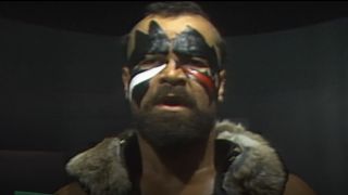 The Barbarian in facial paint in WWE match