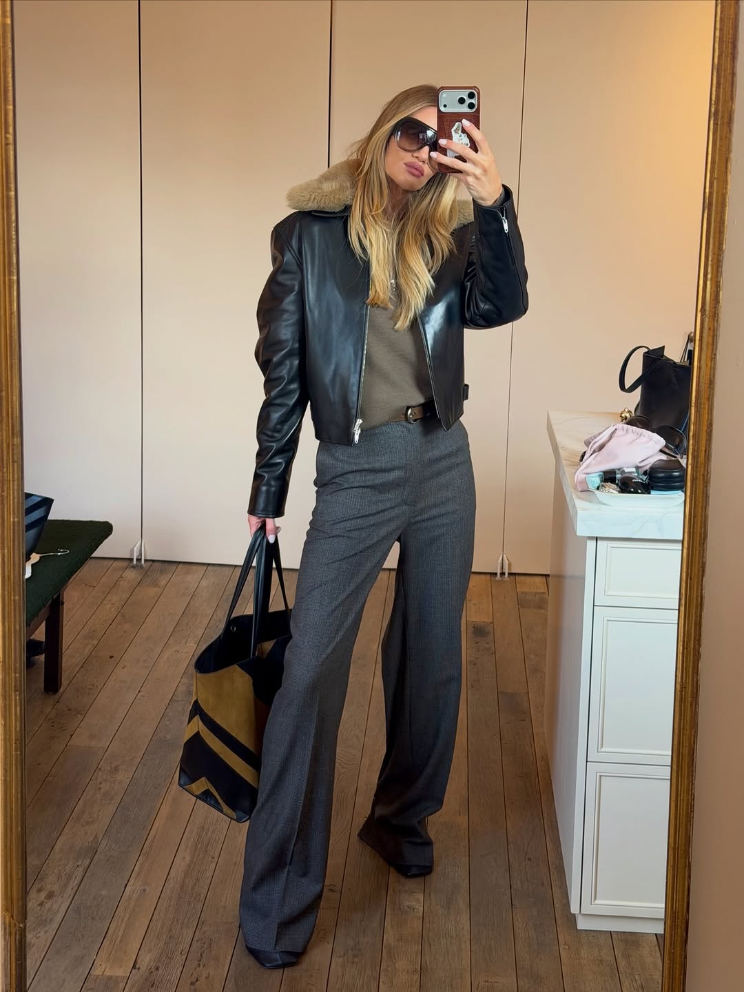 woman wearing oversize sunglasses outfit 2026