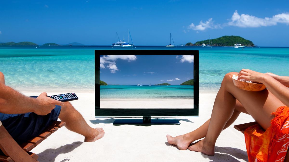 People watching TV on the beach