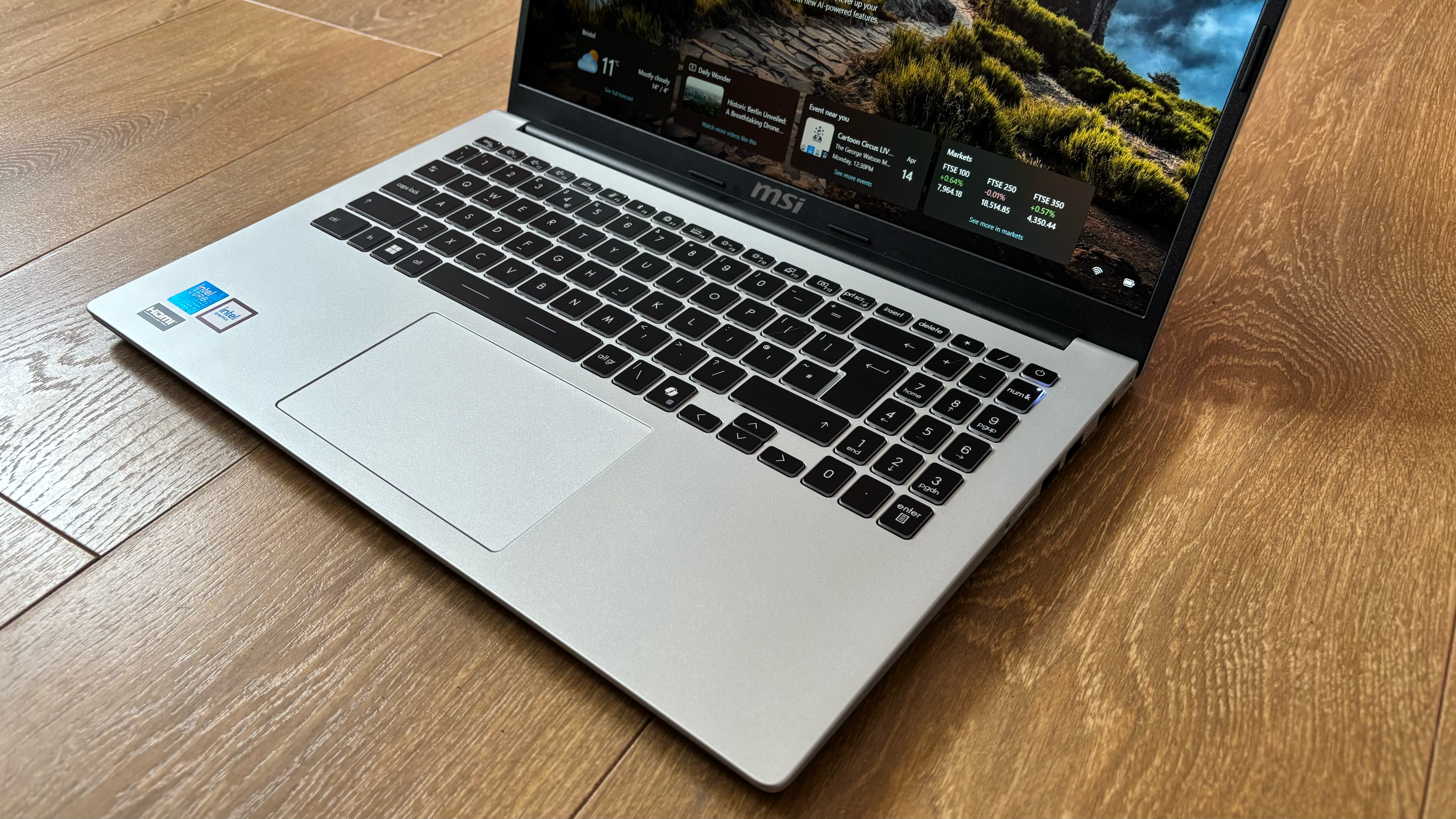 MSI Modern 15 laptop on a wooden desk