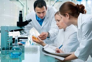 scientists working together in a chemistry lab.