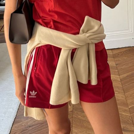 Woman wearing a red T-shirt and red athletic shorts 