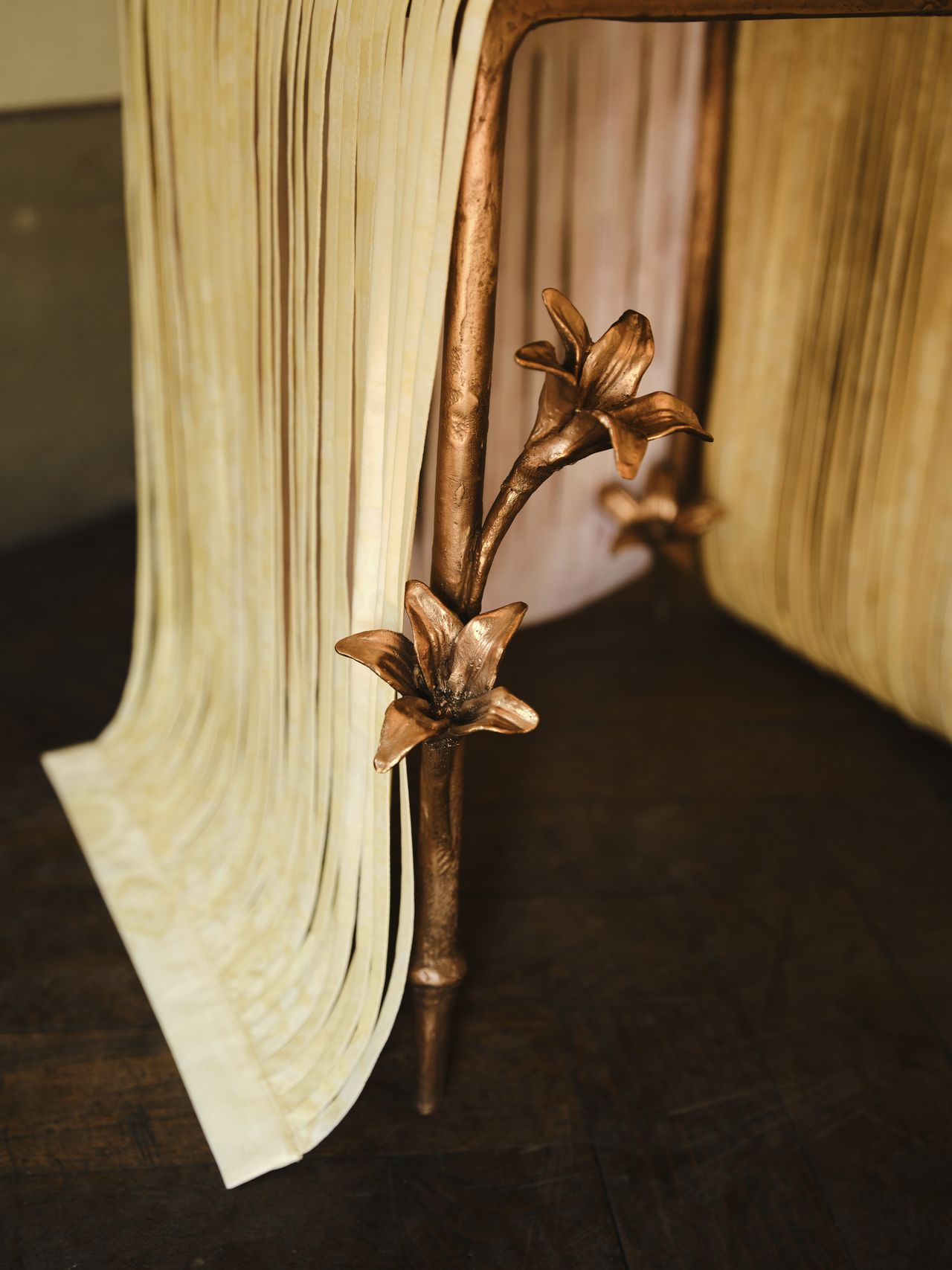 bronze furniture draped in pastel ribbons