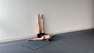 Kelly Turner demonstrates legs up the wall yoga pose